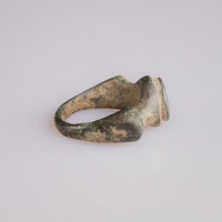 Roman bronze signet ring Corvidus three-quarter view revealing D-section hoop and bezel