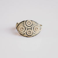 Roman bronze signet ring Numerius with quatrefoil ring-and-dot bezel, top view