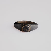 Roman bronze signet ring Numerius with raised circular bezel engraved with a bird motif