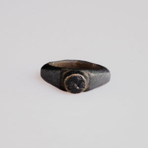 Roman bronze signet ring Numerius with raised circular bezel engraved with a bird motif