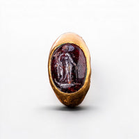 Garnet intaglio of Fortuna with cornucopia and rudder, top view