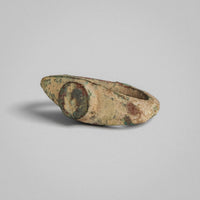 Angled view of Roman bronze ring 'Tullia' showing the navette-shaped top and the worn bezel device
