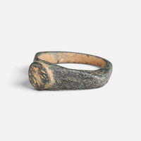 Roman bronze ring 'Aquilarius' shows its worn round bezel and broad shoulder from the opposite angle.