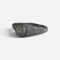 Roman bronze ring 'Hesperia' shows its worn circular bezel and shoulder from the opposite front angle.