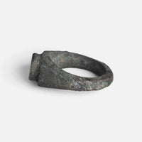 Roman bronze ring 'Hesperia' shows its broad shoulder and bezel edge from the opposite side.
