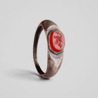 Roman silver ring Marinus, top view of carnelian intaglio likely depicting Neptune on a dolphin