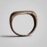 Roman silver ring Tychion, rear view of the hoop showing tarnish and slight faceting near the bezel.
