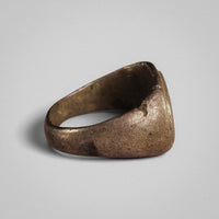 Roman silver ring Tychion, side view showing the tapered D-section hoop and surface patina.