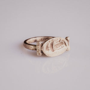 Roman silver swivel-bezel signet ring Numeria with intaglio of a draped female figure, three-quarter view