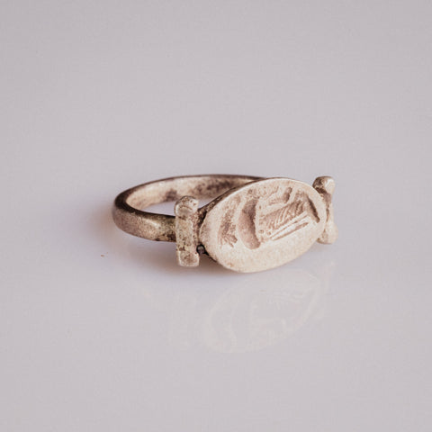 Roman silver swivel-bezel signet ring Numeria with intaglio of a draped female figure, three-quarter view