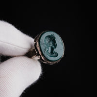 Sasanian silver ring Bahram held in gloved hand showing Persian royal profile intaglio