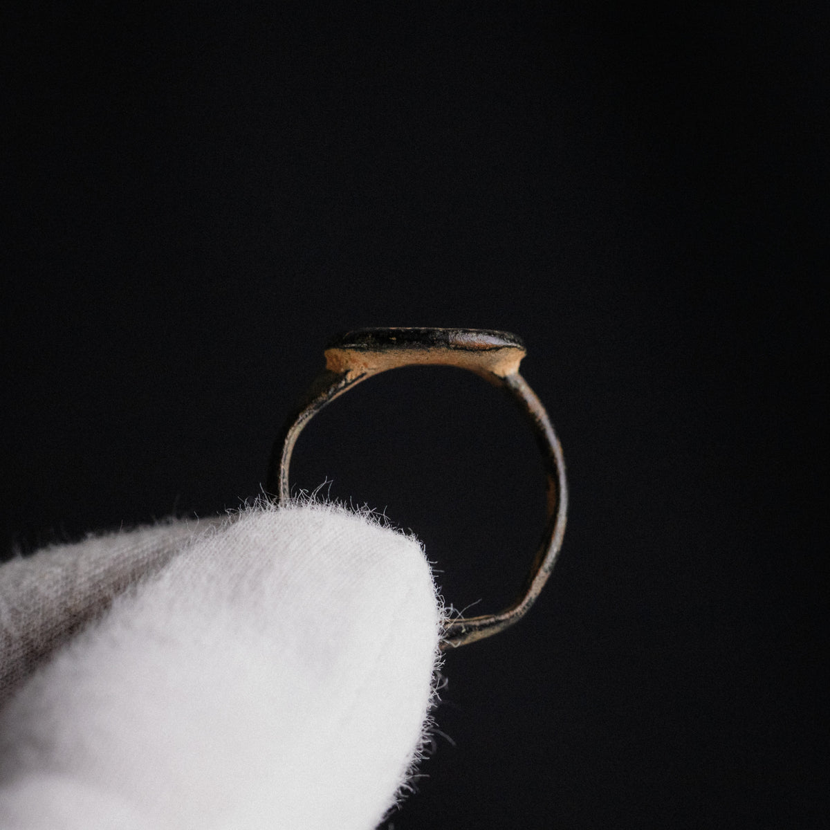 Side profile of Byzantine bronze ring Stellaris showing integral flat bezel and D-section hoop