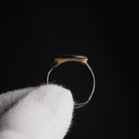 Side profile of Byzantine bronze ring Stellaris showing integral flat bezel and D-section hoop