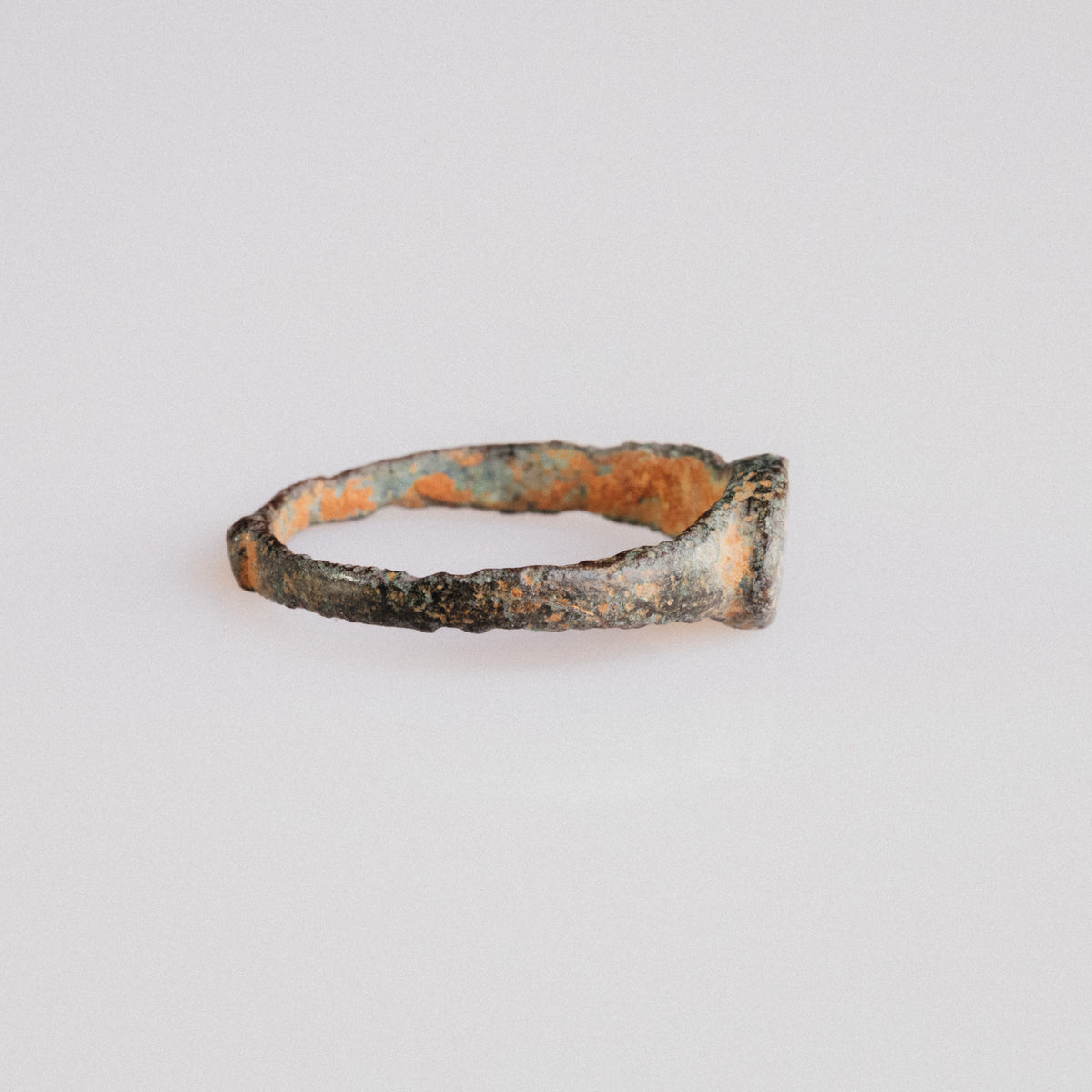 Side profile of Byzantine bronze ring 'Theodora' showing D-section hoop and patina