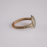 Side profile of Byzantine bronze ring Theodora showing domed bezel and rayed border