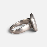 Byzantine silver ring 'Chrysanthos' shows its thin bezel edge and broad shoulder from the side.