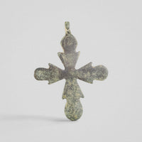 Side profile of Medieval bronze cross pendant 'Rotunda' with intact suspension loop and flat 2 mm plate