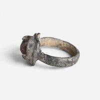 Medieval bronze ring 'Aldonza' shows its raised setting and hoop from the opposite side.
