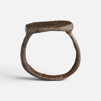 Medieval bronze ring 'Anselm' shows its complete hoop and octagonal bezel edge in profile.