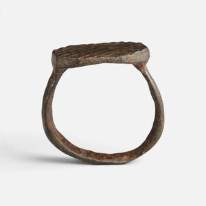 Medieval bronze ring 'Anselm' shows its complete hoop and octagonal bezel edge in profile.