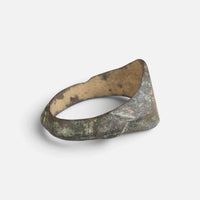 Medieval bronze ring 'Radwin' shows the back of its hoop and the inner shoulder at an angle.