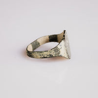 Side profile of medieval bronze ring Vitalya revealing flat band and bezel patina