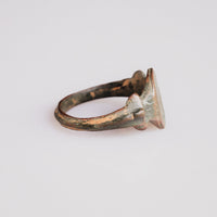 Side profile of medieval bronze ring Vukasin showing round hoop and cast shoulder projections