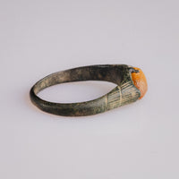 Side profile of medieval bronze ring Vukmir with malachite patina and cabochon stone
