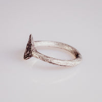 Side profile of medieval silver ring Ruslan showing the lozenge bezel silhouette