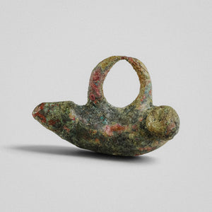 Side profile of Roman bronze pendant 'Felix' showing tapered glans and spherical terminal