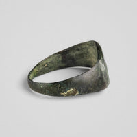 Side profile of Roman bronze ring Equirius showing sphendone form and patina gradation
