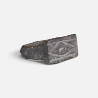 Roman bronze ring 'Lucina' shows its rectangular bezel engraving and broad shoulder at an angle.