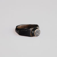 Side profile of Roman bronze ring Numerius showing wide shoulders and D-section hoop