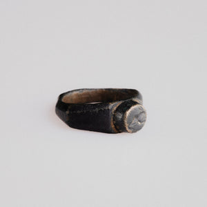 Side profile of Roman bronze ring Numerius showing wide shoulders and D-section hoop