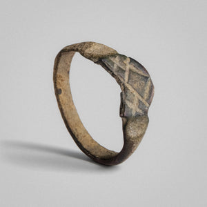 Side profile of Roman bronze ring Vitricus revealing D-section hoop and patina