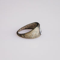 Side profile of Roman bronze ring Volusia with D-section hoop and sloping shoulders