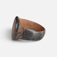 Byzantine bronze ring 'Kallisto' shows its engraved shoulder and broad bezel edge from the opposite side.