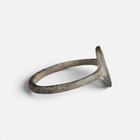 Byzantine bronze ring 'Kassia' shows its oval bezel edge and narrow hoop from the side.