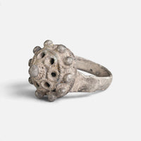 Byzantine silver ring 'Thalios' shows its pierced dome and rounded bosses from the opposite front angle.