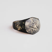 Side view of medieval bronze ring Astariel showing six-pointed star shoulder motifs