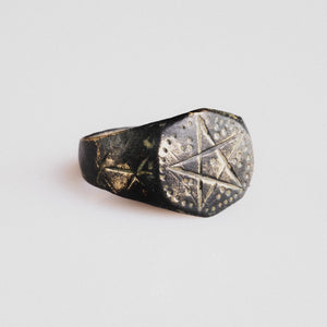Side view of medieval bronze ring Astariel showing six-pointed star shoulder motifs