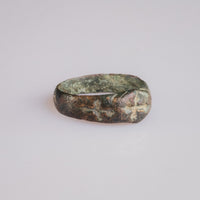 Side view of medieval bronze ring Radenko showing shoulder cross and green patina.