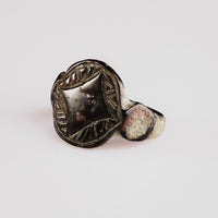 Three-quarter view of medieval bronze ring Aldwyn with engraved lozenge field