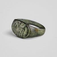 Three-quarter view of Roman bronze ring Equirius showing horse-and-rider bezel detail