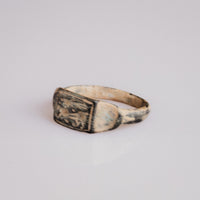 Three-quarter view of Roman bronze ring Grypho with griffin engraving on bezel