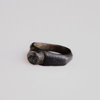 Three-quarter view of Roman bronze ring Numerius with engraved bird bezel