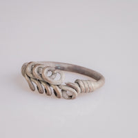Roman silver wire ring 'Nodus' shows its loop rows and wound shoulder from the opposite front angle.