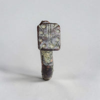 Top-down view of Byzantine bronze ring Kyros with incised cross and eight pellets