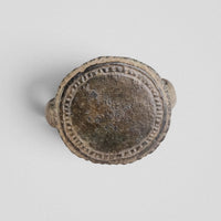 Top-down view of Byzantine bronze ring Xenaros bezel with concentric hatched border