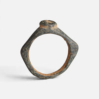 Roman bronze ring 'Aquilarius' shows the raised round bezel edge above its complete hoop in profile.